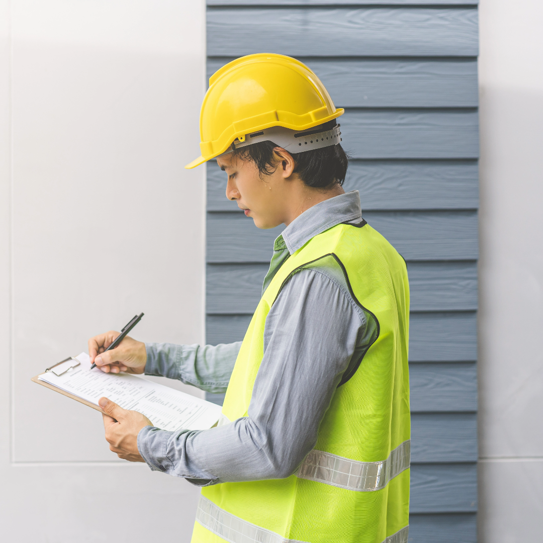 a man inspecting a building