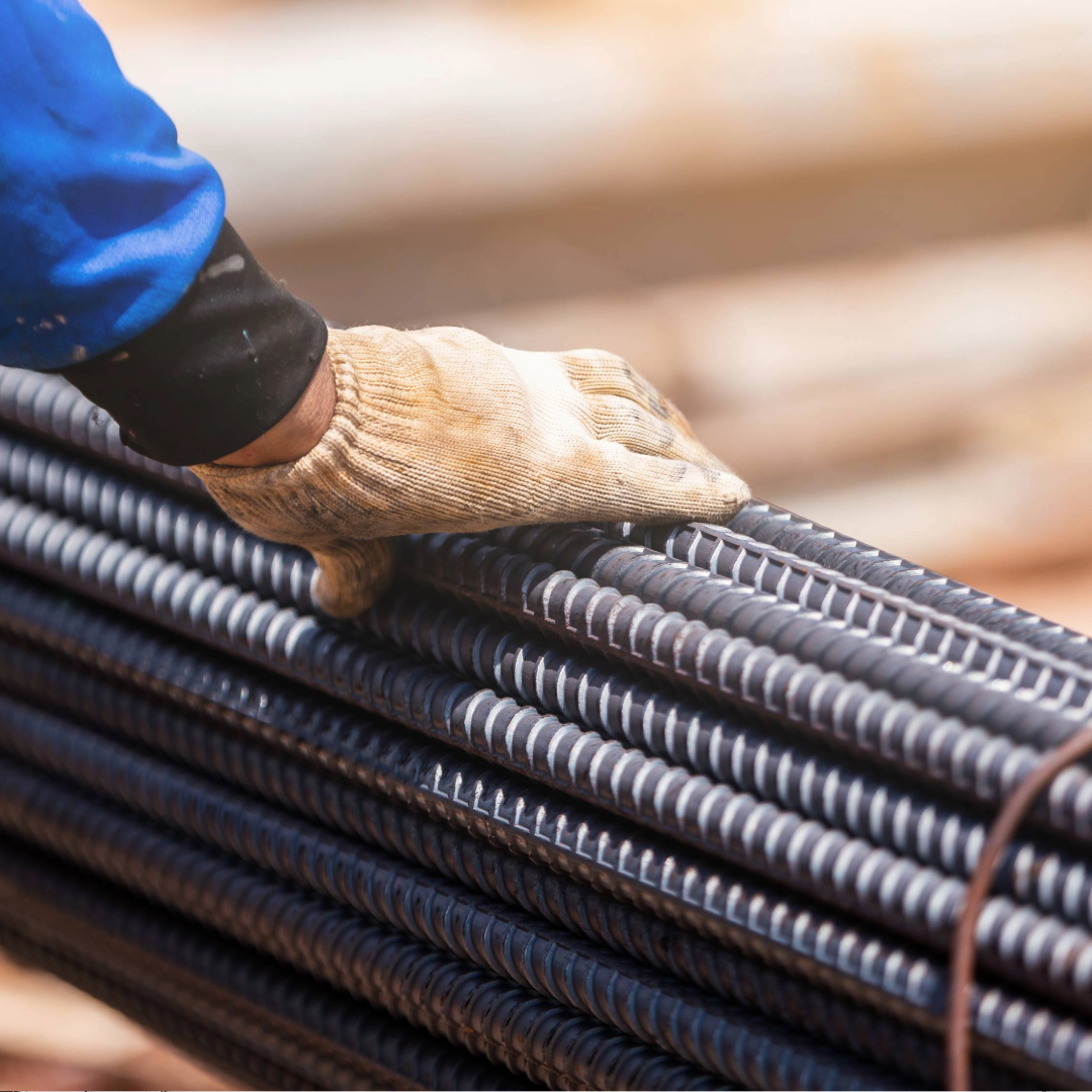 stack of dark grey metal pipes