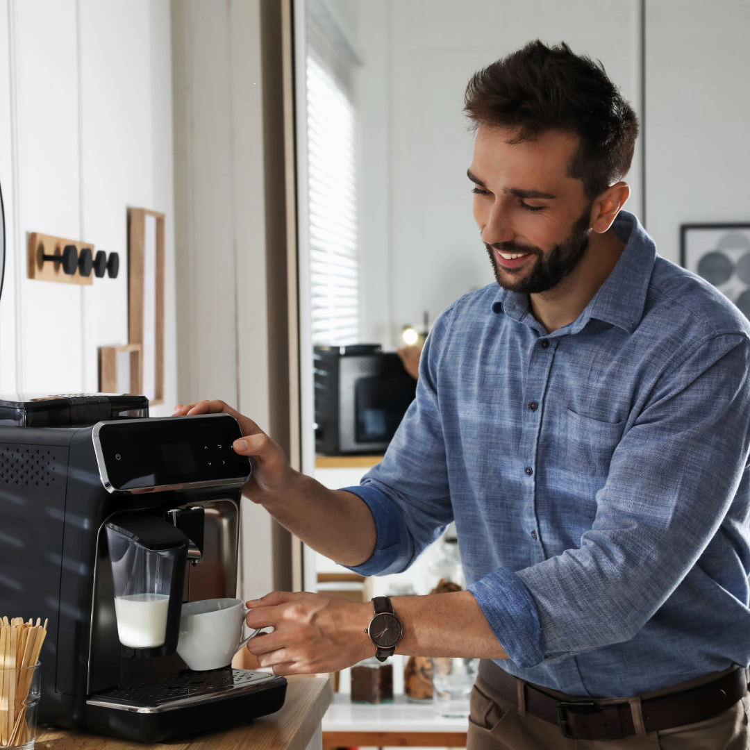 a man using a coffee machine