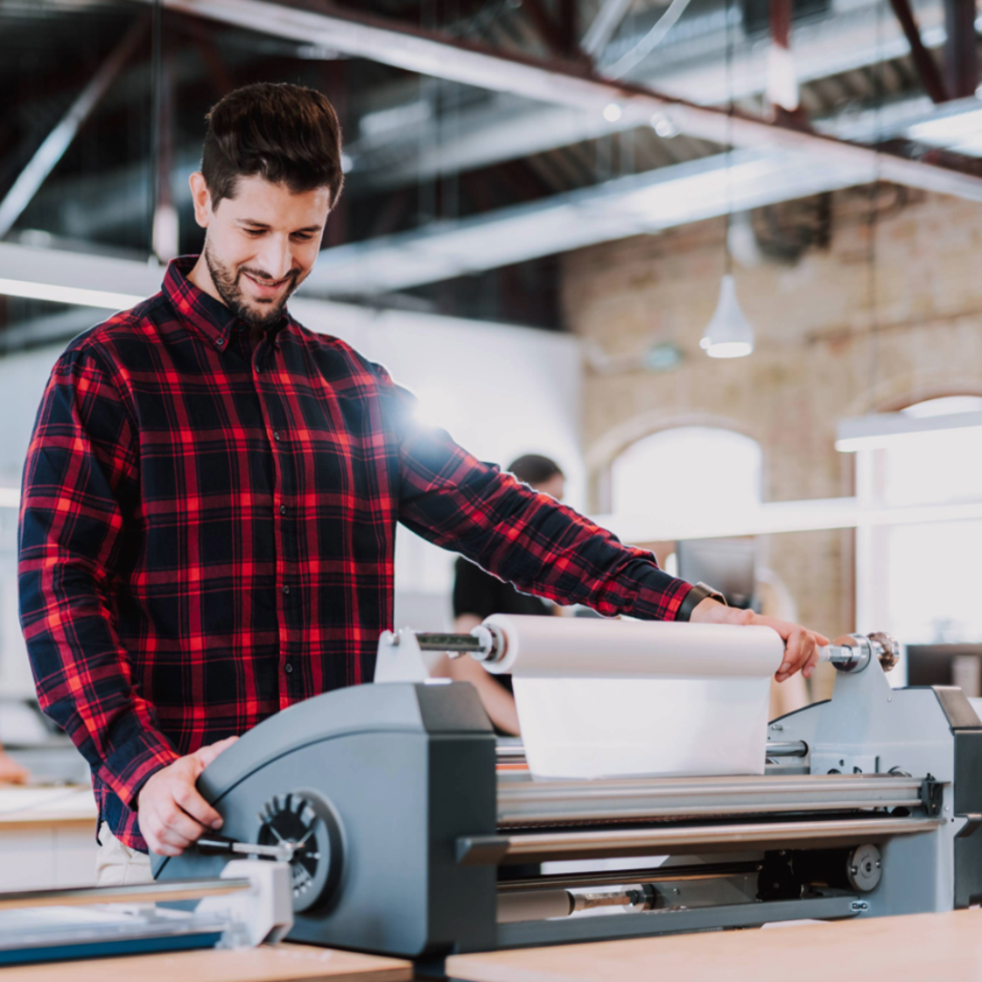 a man using a printing machine