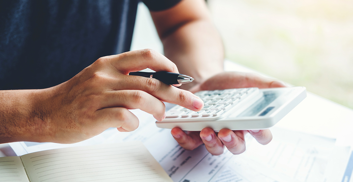 man using a calculator