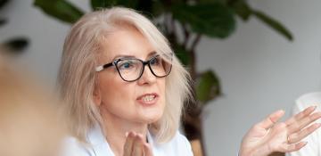 Woman with glasses moving her hands
