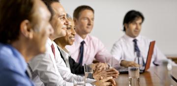 People smiling in a meeting