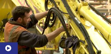Man looking at machinery